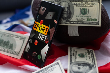 rugby ball and dollars with usa flag and smartphone bet