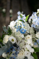 Obraz na płótnie Canvas Bridal bouquet. Wedding. Beautiful bouquet of white, blue flowers and greenery. Fresh flowers bouquet.