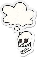 laughing skull cartoon and thought bubble as a distressed worn sticker