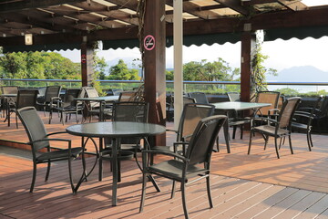 a chairs and table under the tree.