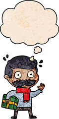 cartoon man with mustache and christmas present and thought bubble in grunge texture pattern style