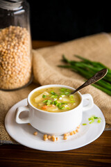 dried pea soup in a plate with herbs
