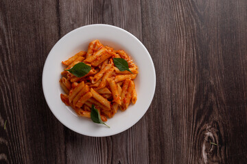 spaghetti with tomato sauce and parmesan