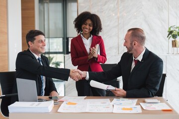 business holding hands, businessmen are agreeing on business together and shaking hands after a successful negotiation. Handshaking is a or congratulation