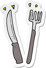 sticker of a cartoon knife and fork