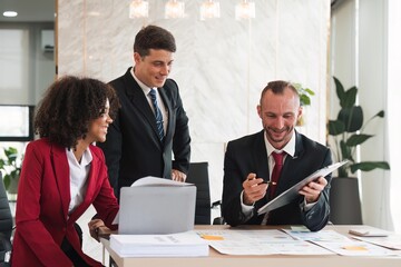 Diverse business team discussing project at corporate briefing in boardroom. colleagues meeting for brainstorming, sharing ideas, together. Teamwork concept