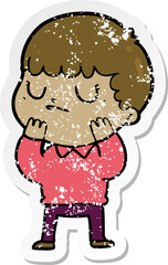 distressed sticker of a cartoon grumpy boy