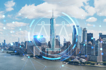 Fototapeta na wymiar Aerial panoramic helicopter city view of Lower Manhattan and Downtown financial district, New York, USA. Glowing hologram legal icons. The concept of law, order, regulations and digital justice