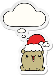 cute cartoon bear with christmas hat and thought bubble as a printed sticker