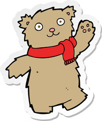 sticker of a cartoon teddy bear wearing scarf
