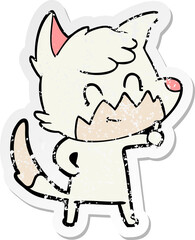 distressed sticker of a cartoon friendly fox