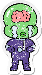 distressed sticker of a cartoon big brain alien crying