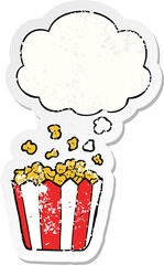 cartoon popcorn and thought bubble as a distressed worn sticker