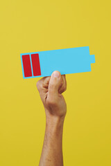 holds a low battery in his hand