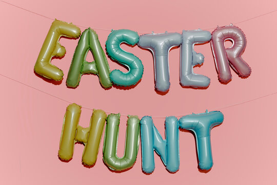 text easter hunt on a pink background