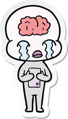 sticker of a cartoon big brain alien crying