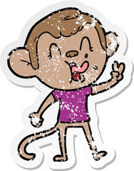 distressed sticker of a crazy cartoon monkey