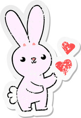 distressed sticker of a cute cartoon rabbit with love hearts