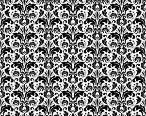 Floral pattern. Vintage wallpaper in the Baroque style. Seamless vector background. White and black ornament for fabric, wallpaper, packaging. Ornate Damask flower ornament