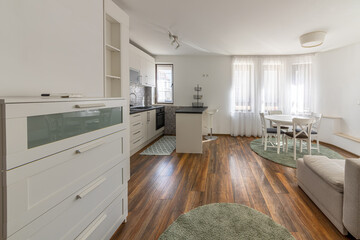 New modern living room with kitchen. New home. Interior photography. Wooden floor