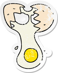 distressed sticker of a quirky hand drawn cartoon cracked egg