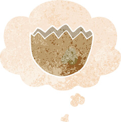cartoon cracked eggshell and thought bubble in retro textured style