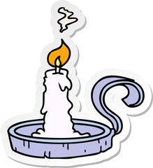 sticker cartoon doodle of a candle holder and lit candle