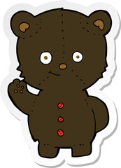 sticker of a cartoon black bear cub