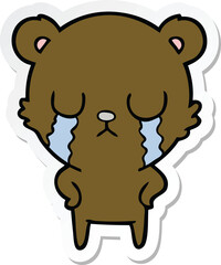 sticker of a crying cartoon bear