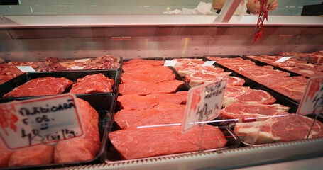Large amount of meat on display in a butcher shop. Food industry concept.