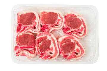 Six fresh raw lamb loin chops on plastic tray and white background. Meat product of high quality and value. Food supply business.