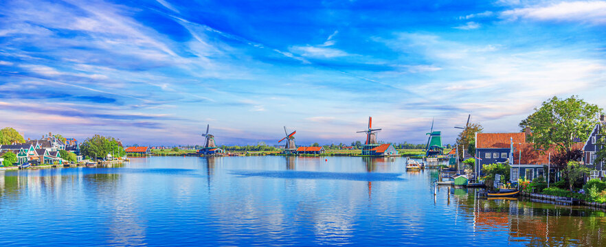 Panorama of traditional dutch houses at the Zaan river in Zaandijk, Netherlands.