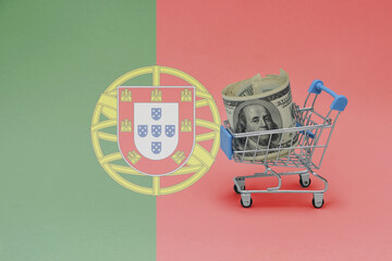 Metal shopping basket with dollar money banknote on the national flag of portugal background. consumer basket concept. 3d illustration