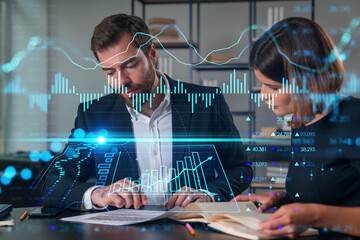 Businesspeople in formal wear taking notes signing contract at office workplace. Concept of important working moments, document sign, working process, concentration. Financial charts