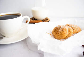 
Photo of oatmeal cookies, cookies, cinnamon, black coffee. on a white table