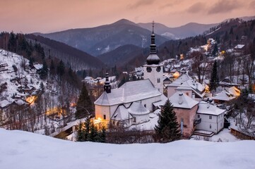 Fototapeta na wymiar Magic village in early morning, epic winter views, beautiful nature and village in mountains, Slovakia, Spania valley, Spania dolina