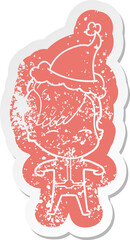 cartoon distressed sticker of a girl wearing futuristic clothes wearing santa hat