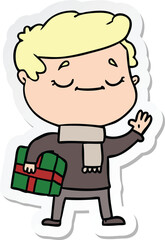 Fototapeta premium sticker of a cartoon man carrying christmas present waving