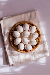 Fototapeta na wymiar Eggs on a white background. Chicken eggs on a plate. We are preparing for Easter