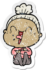 distressed sticker of a cartoon happy old woman
