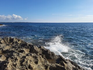 waves crashing on rocks