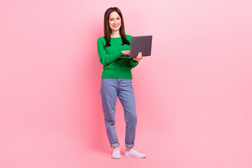 Full body portrait of positive pretty lady hold use wireless netbook isolated on pink color background