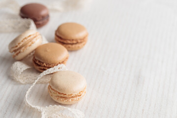 Colorful pastel eco handmade natural macaroons on white table. Gift for 8 March, International Women's Day, Valentine Day