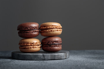 Chocolate eco handmade natural macaroons on dark background in the darkmood style