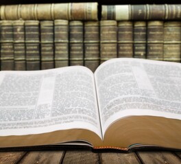 Open Holy Bible book on the desk