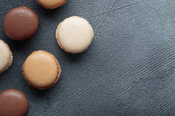 Colorful pastel eco handmade natural macaroons on dark background. Gift for 8 March, International Women's Day, Valentine Day, top view