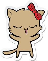 sticker of a cartoon cat with bow on head