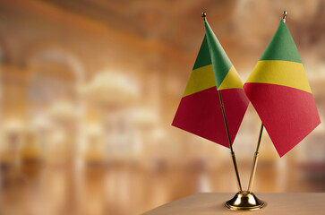 Small flags of the Congo on an abstract blurry background