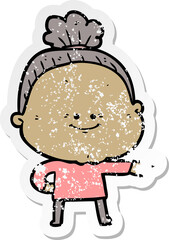 distressed sticker of a cartoon happy old woman