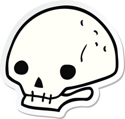 sticker of a cartoon spooky skull